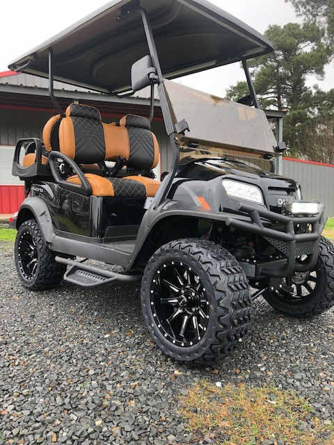Lifted custom golf cart with premium seats
