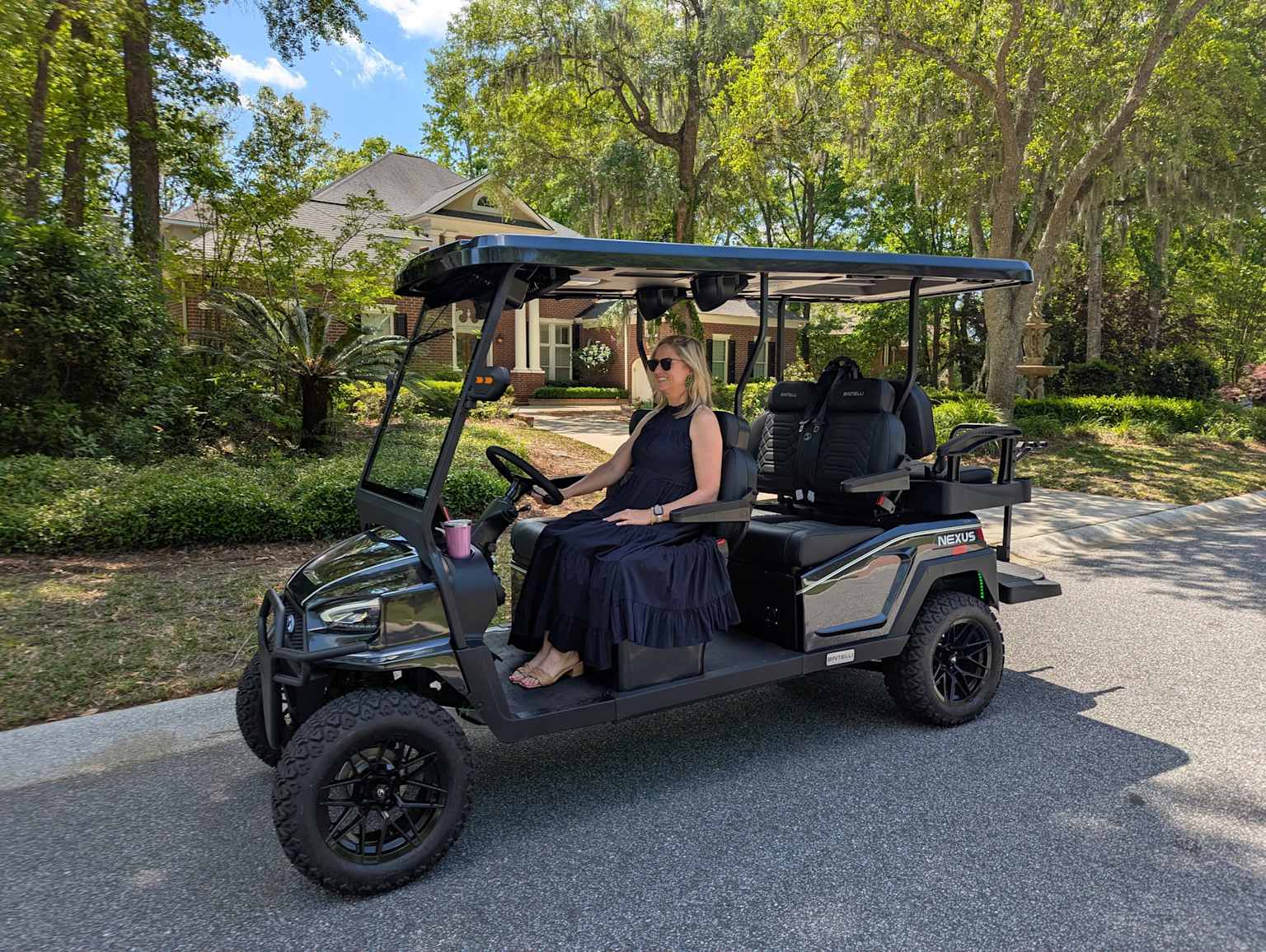 Custom lifted golf cart in a high‑end neighborhood